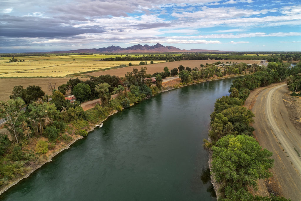 Sacramento River with Sutter Buttes in background